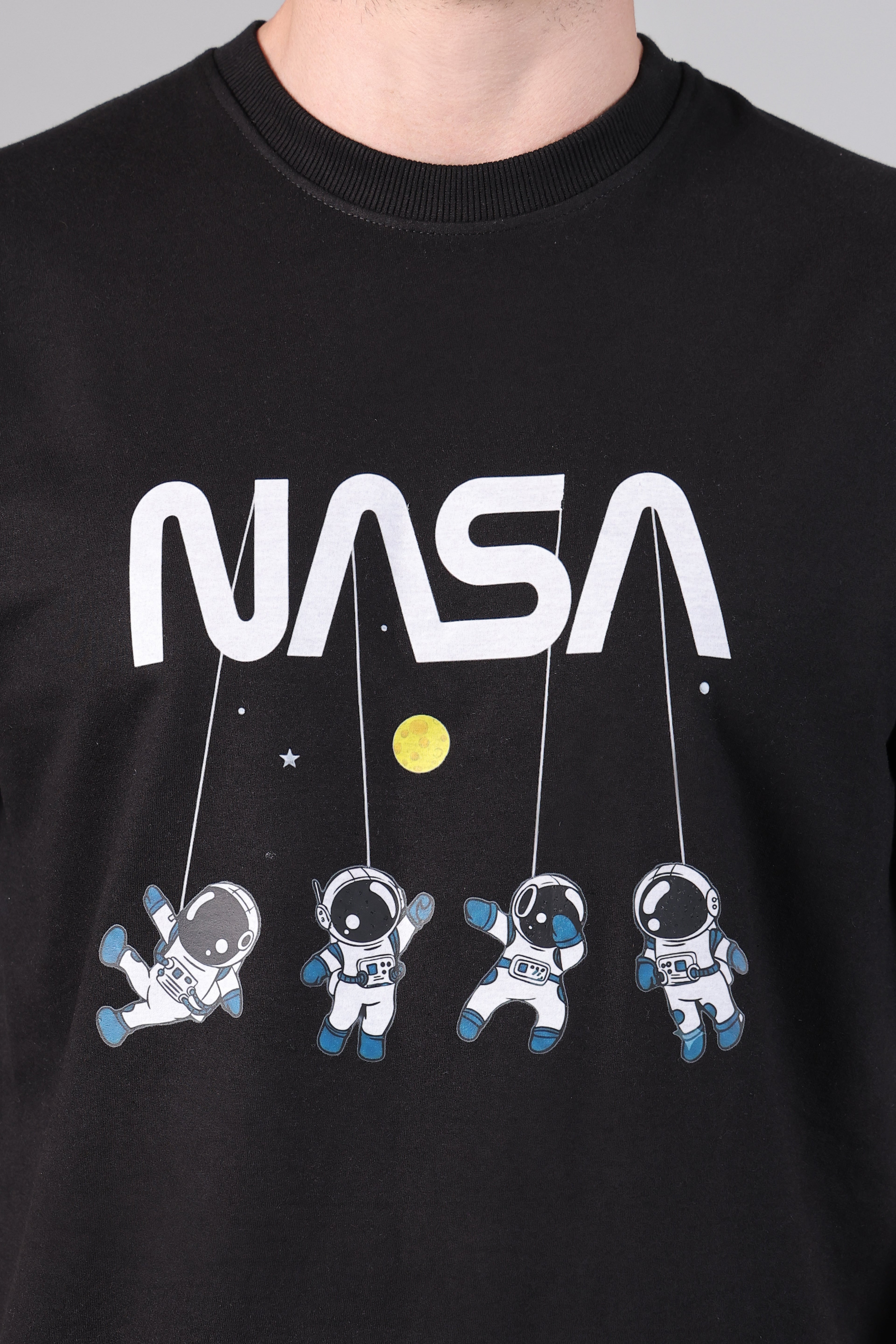 Men's Black Loose Fit Tee with NASA Logo and Floating Astronaut Print